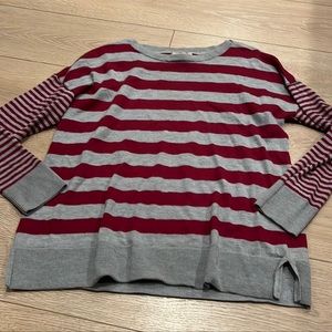 This sweater is an XL but runs very small excellent condition